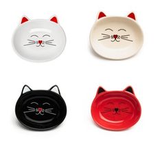 four cat bowls with faces on them