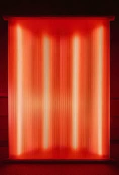 an image of a red light in the middle of a room with vertical lines on it