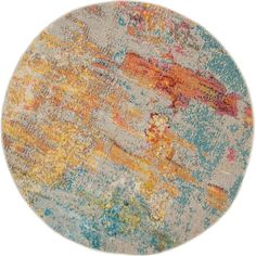 an area rug with multicolored paint on it and a circular design in the middle