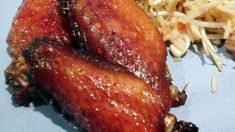 a close up of food on a plate with meat and coleslaw next to it