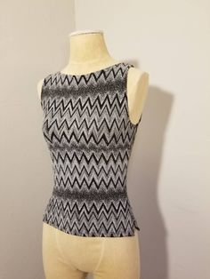 "++ IZ BYER CALIFORNIA TOP ++ Awesome metallic glitter top Zig zag design Sleeveless Small side slits on both sides Size M Made in the USA In wonderful, gently used condition ✂ - - - Measurements laid flat: Pit to pit: 14.5\" Waist: 13\" Top to bottom: 20\" Let's be friends! https://www.facebook.com/TheGirlSaidYesVintage round rack" Y2k Fitted Tank Top, Y2k Tank Top For Night Out, Fitted Y2k Tank Top, Sleeveless Party Tank Top, Y2k Sleeveless Party Tops, Y2k Sleeveless Stretch Tops, Fitted Sleeveless Top For Night Out, Casual Fitted Party Vest, Y2k Fitted Sleeveless Tops