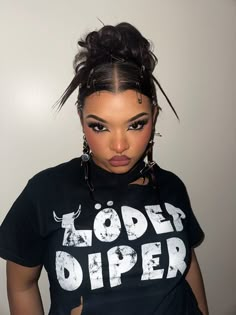 a woman wearing a black shirt with the words lodger upper on it and her hair in a bun