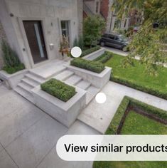 an outdoor garden with steps and planters in the center, surrounded by green grass