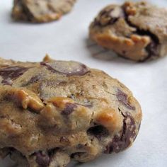 several chocolate chip cookies on a baking sheet