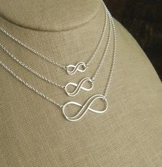 Sterling silver double infinity necklace, infinity knot, infinity symbol, bridal jewelry, sterling silver necklace, eternity necklace A double wire infinity link is attached to a sterling silver chain that can be any length up to 22 inches in length and is secured with a sterling silver lobster claw clasp. You can choose between the small, medium, and large infinity links. The small infinity measures 0.55 x 0.26 inches (14 x 6.5mm). The medium infinity measures 0.79 x 0.37 inches (20 x 9.5mm). T Sterling Silver Infinity Necklace With Adjustable Chain, Silver Infinity Necklace With Delicate Chain, Silver Infinity Jewelry, Silver Infinity Necklaces For Wedding, Silver Infinity Necklace For Wedding, Silver Infinity Necklace In Dainty Style, Silver Infinity Dainty Necklace, Silver Dainty Infinity Necklace, Minimalist Sterling Silver Infinity Necklace