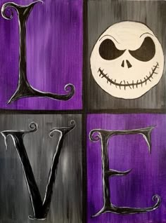 the letter v is painted in black and purple with a jack - o'- lantern face