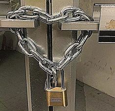 a heart shaped padlock attached to a door