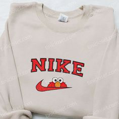 The Nike x Elmo Cartoon Embroidered Sweatshirt is a must-have for any fan of the iconic Sesame Street character. Made from premium quality materials, this sweatshirt features a vibrant and detailed embroidery of Elmo, adding a playful touch to your outfit. With its comfortable fit and cozy fabric, it is perfect for chilly days or [...] Disney Sweater Ideas, Mouse Candy, Cute Christmas Sweaters, Nike Cartoon, Nike Inspired, Best Family Gifts, Cute Nike Outfits, Nike Sweaters, Nike Pullover