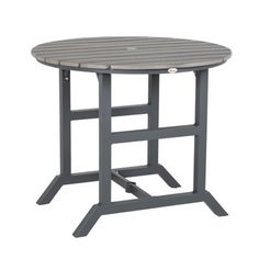 an outdoor table with grey wood top and metal base, on a white background the table is round