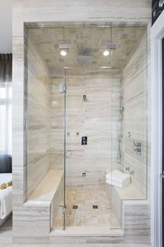 a walk in shower sitting inside of a bathroom