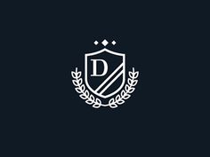 the letter d is surrounded by laurels and leaves in this monogrammed logo