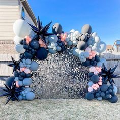 an arch made out of balloons and stars