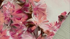 an abstract painting with pink flowers on a white background