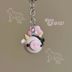 a key chain with a cow on it