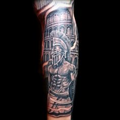 a man's arm with a roman soldier tattoo on it