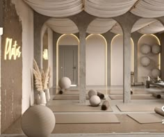 a room filled with lots of white vases and balls on top of yoga mats