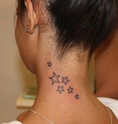 a woman's neck with stars tattoo on her left side ribcage and behind the ear