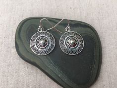 "These are unique and highly detailed boho disc earrings. They have a unique eye catching design and would be perfect for everyday wear. They measure 7/8\" across by 1\" long and hang from simple elegant ear wires. The earrings are made from allergy free plated silver. I have a matching necklace in my shop, if you would like the whole set. Here is the link https://etsy.me/2X6CB2r Thanks for stopping by. Please take a moment and visit the rest of my shop. I have many more unique jewelry designs t Southwestern Style Festival Earrings, Southwestern Style Round Festival Earrings, Southwestern Style Festival Round Earrings, Southwestern Metal Earrings For Gift, Southwestern Style Metal Earrings For Gift, Adjustable Southwestern Round Earrings, Nickel-free Southwestern Style Festival Earrings, Bohemian Hypoallergenic Earrings For Festivals, Round Festival Earrings