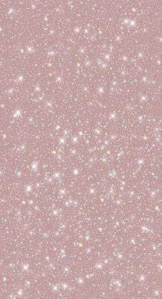 a pink background with small white stars on the top and bottom half, in different colors