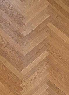 an image of wood flooring that looks like herringbones