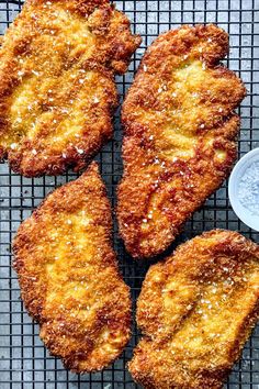 four fried food items on a cooling rack