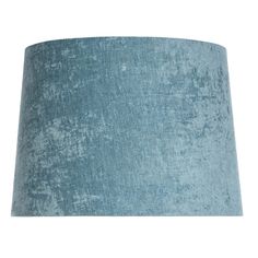 a blue lamp shade on a white background