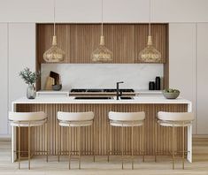 a kitchen with white counter tops and stools next to an island topped with plants