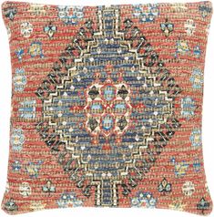 a red and blue pillow with an intricate design