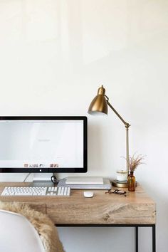 a desktop computer sitting on top of a wooden desk