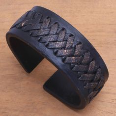 Tomomi of Bali designs a black leather cuff bracelet with strength and style. The bracelet features distressed black leather lacing criss-crossed along the center of the cuff. Imperial Leather, Black Leather Cuff Bracelet, Wristband Bracelet, Leather Wristbands, Leather Cuffs Bracelet, Women Artisans, Leather Cuffs, Jewelry Packaging, Brass Color