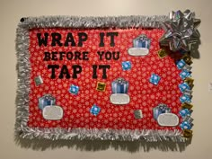 a bulletin board that says wrap it before you tap it on the wall with decorations