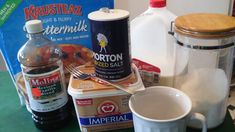 ingredients to make an ice cream dessert displayed on counter with milk, sugar and other items