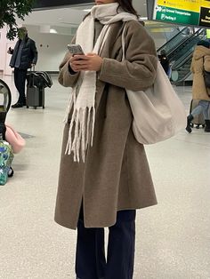 Airport fashion — Cos taupe wool coat, Etsy white wool scarf, beige handbag Taupe Wool Coat Outfit, Taupe Wool Coat, Wool Coat Outfit Aesthetic, Oversized Beige Wool Coat For Workwear, Long Coat Aesthetic, Oversized Brown Wool Coat For Fall, Beige Wool Coat Outfits, Light Brown Coat Outfit, Oversized Wool Outerwear In Beige