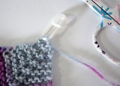 a crocheted piece of yarn next to a pair of scissors