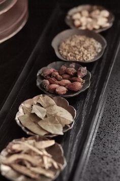 several bowls filled with different types of food