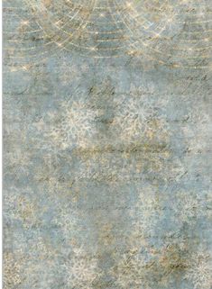 an old, faded rug with snowflakes on it