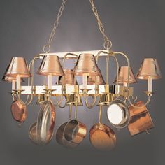 a chandelier with many different types of pots and pans hanging from it