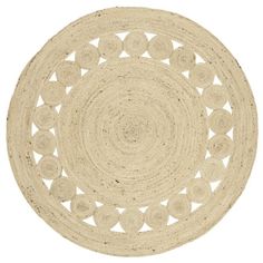 a white round rug with circles on it