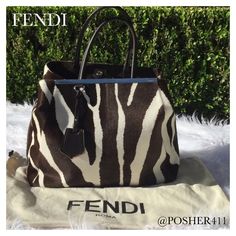 FENDI LARGE 2JOURS BROWN CALF HAIR TOTE BAG FENDI Large Zebra Printed Calf Hair Tote Luxurious calf hair in an exotic zebra print with signature silver-tone hardware, dual rolled brown leather top handles, approx 6" drop snap closure, protective feet at base & suede lining w interval zip pocket. Color: Chocolate Brown & Cream/Ivory. Approx Measurements: Shoulder Strap Drop 6.5”, Height 13", Width 15.5”, Depth 5.5" SOLD OUT! This large Fendi is stunning! Condition: Excellent. Fendi Bags Brown Leather Top, Fendi Handbags, Color Chocolate, Calf Hair, Fendi Bags, Zebra Print, Leather Top, Chocolate Brown, Snap Closure