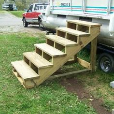 a truck parked next to a set of stairs