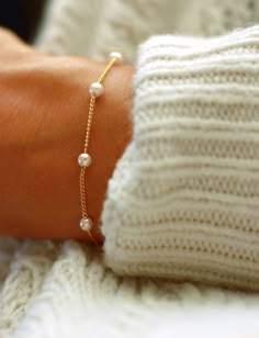 A dainty Pearl Finished Beaded Bracelet. Makes a beautiful gift for mothers, grandmothers, sisters, daughters, friends or Bridesmaid Gift.  D E S I G N ∙ D E T A I L S  ● Available in gold plated or silver plated  ● Model is wearing size 6.5" (model wears size small blouse for sizing reference)   ● 1/2 inch Extender included  ● If you'd prefer the bracelet made without the extender chain, please leave a note at      checkout.  G I F T ∙ P A C K A G I N G  * Each purchase will arrive in beautiful Dainty Pearl Bracelet, Jewelry Layering Bracelets, Bridesmaid Pearl Bracelet, Pearl Bracelet Wedding, Gold Pearl Bracelet, Jewelry Layering, Pearl Bracelet Gold, Bridesmaid Pearls