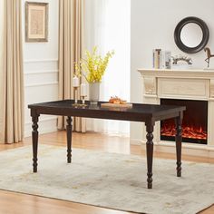 a living room scene with focus on the coffee table and fire place in the fireplace