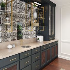 a kitchen with marble counter tops and gold accents