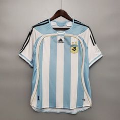 a soccer jersey hanging on a hanger