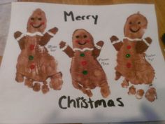 three handprinted gingerbreads on a piece of white paper with words merry and christmas