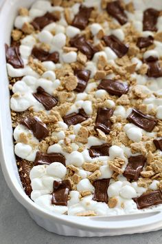 a baking dish filled with marshmallows and chocolate