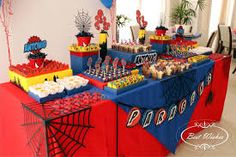 a spiderman themed birthday party with desserts