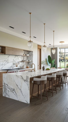 Embrace the elegance of marble and polished wood with these 25 modern luxury kitchen ideas. From sleek black kitchens to American kitchen designs, these spaces showcase sophisticated decor and high-end finishes. Perfect for those who seek a refined and stylish cooking environment. #MarbleKitchen #ModernLuxury #PolishedWood Elegant Kitchen Design, Kitchens Luxury, Dream Kitchens Design, 아파트 인테리어, Elegant Kitchens, Luxury Kitchen Design, Kitchen Inspiration Design, Luxury Kitchens