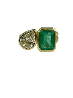 This 18k yellow gold emerald and diamond ring weighs 6.5 grams. Nice and sturdy, the ring has a two-stone, toi et moi design featuring an emerald weighing 2.27 carats (exactly) and a diamond weighing 1.31 carats (exactly). The emerald is faceted in a classic emerald cut and is securely set in its' own bezel setting. The stone has a dark green color with good fire and translucency, with minor natural inclusions commonly found in emeralds that do not affect the stones beauty. It is is set next to a singular pear shape diamond, jeweler graded to be I in color and SI1 in clarity. Both stones are fine gems, immensely brilliant and containing lots of shine. They come together to create a gorgeous, one of a kind, high quality piece that is sure to turn heads when worn. The ring comes as a size 6. Emerald Toi Et Moi Ring, Emerald And Diamond Ring, Square Cut Engagement Rings, Emerald Ring Vintage, Natural Emerald Rings, Bezel Engagement Ring, Pave Diamond Band, Pear Ring, Jewelry Ads