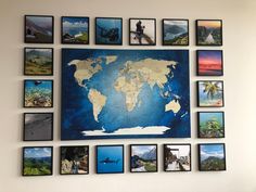 a wall with many different pictures on it and a map hanging up against the wall